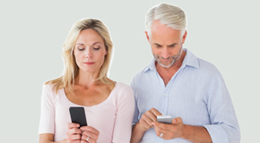 Minster couple using smartphones