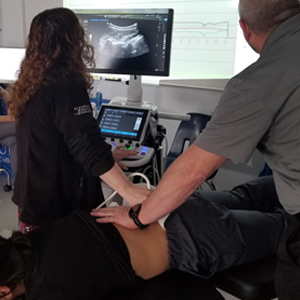 picture Minster chiropractic ultrasound imaging of spinal vertebrae during treatment